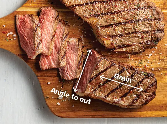 Slicing Cooked Beef Against the Grain with knife Slicing Cooked Beef Against the Grain