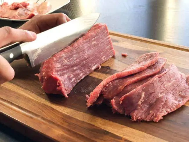 Cut jerky meat with knife