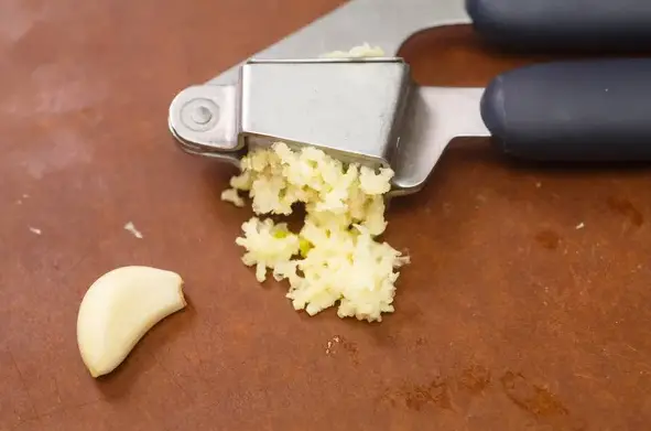 What is a garlic press slicer
