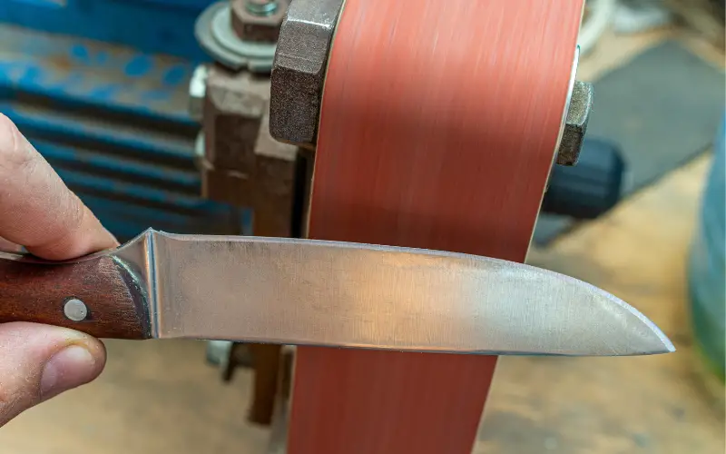 Sharpening a knife with a leather belt How To Sharpen A Knife Using A Belt Sharpener