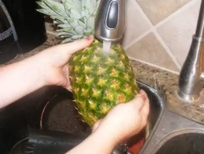 How do you wash a pineapple before cutting