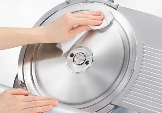 How often should I clean my meat slicer