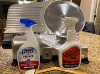 Is it safe to use a meat slicer after cleaning it with a sanitizer