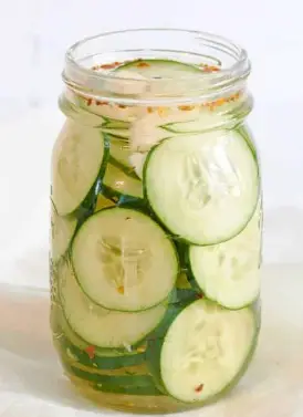 Slice the cucumber and immediately transfer it to an airtight container. Slice the cucumber and immediately transfer