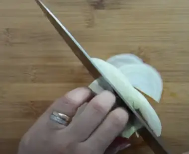 How to Cut an Onion Slice the onion in half