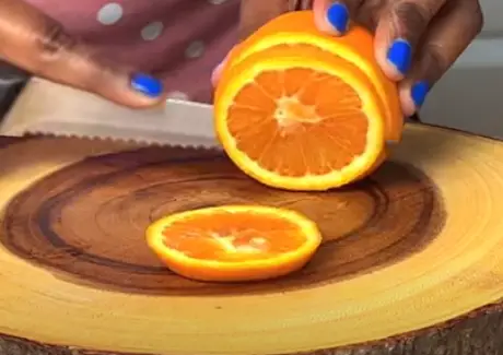 Start preparing your oranges by slicing them