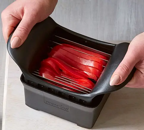 slicing Tomato with slicer Tomato