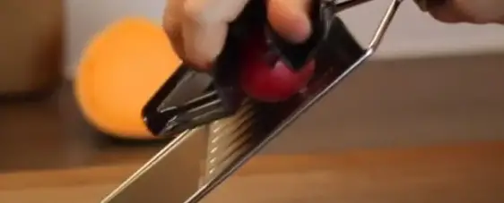 Place Your Food Onto The Slicer And Secure It Using The Safety Handle Use the safety handle