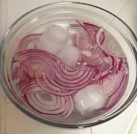Why do you soak chopped onions in water