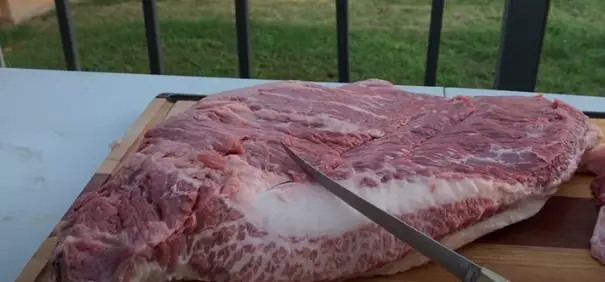 Cut the brisket Cut the brisket in half lengthwise