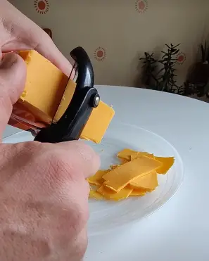 Grating Cheese Using A Vegetable Peeler