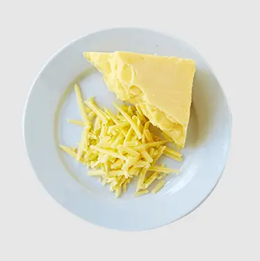 Leave the frozen cheddar cheese on a plate