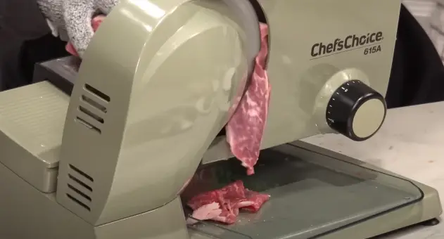 Slicing Meat With Slicer Meat