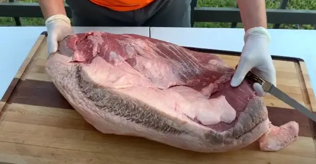 Place the brisket flat on a cutting board Place the brisket flat on a cutting board