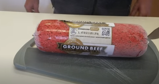 Place the frozen ground beef on a cutting board