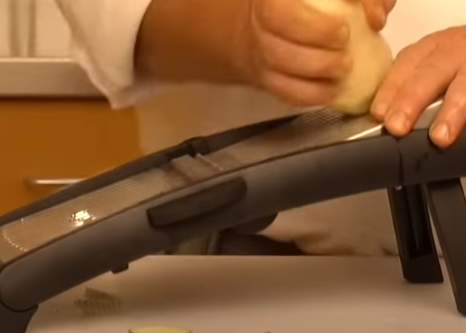 Place the vegetable on the slicer's platform Position the vegetable