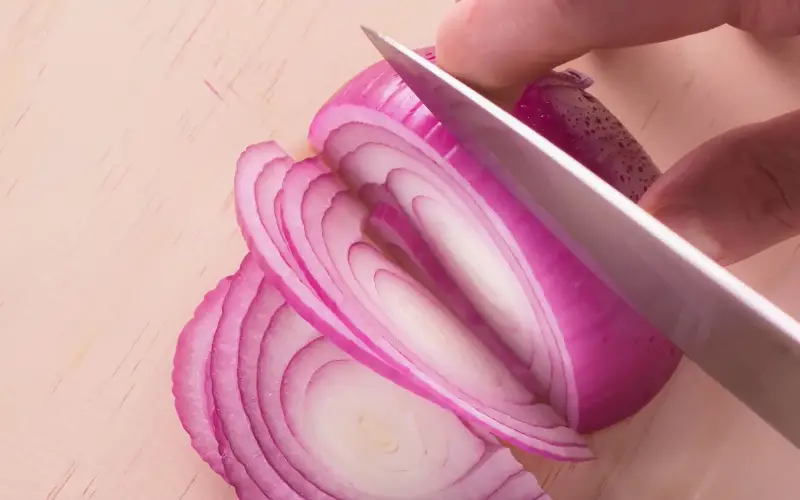 Slicing involves cutting a food item into thin, flat pieces. Slicing