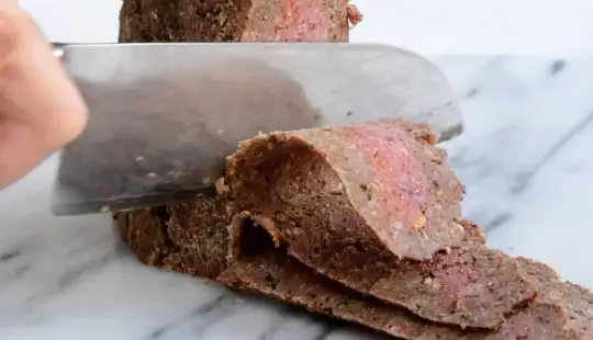 Turn the block of ground beef 90 degrees and cut the thin strips