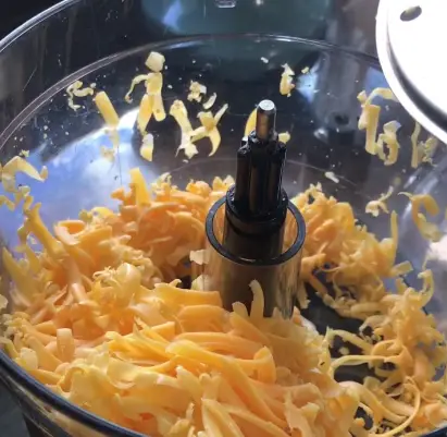 Using a food processor to grate cheese