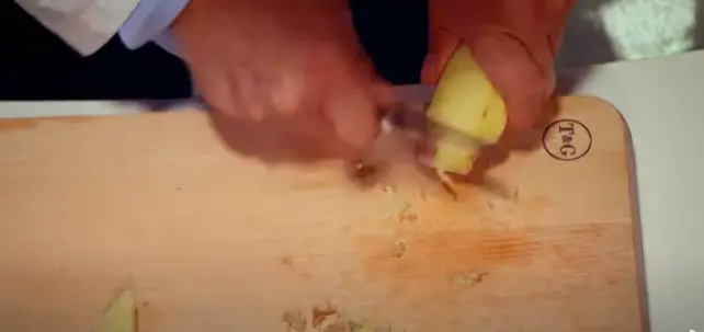 After trimming, use the back of your knife to peel or scrape off the skin