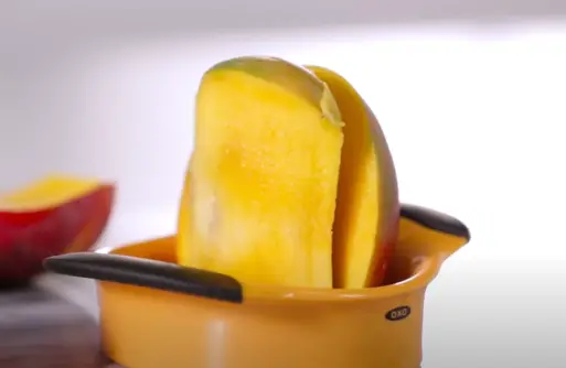 Can the OXO Mango Slicer cut through the pit