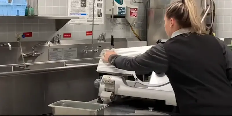 Using Cloth For Cleaning The Slicer Clean the slicer