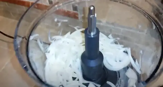 Collect the sliced onions and repeat the process with any remaining onion pieces Collect the sliced onions