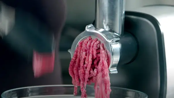 Feed The Meat Into The Grinder, Gently Pushing It Down The Tube With A Stomper Or Your Hand Feed the meat into the grinder