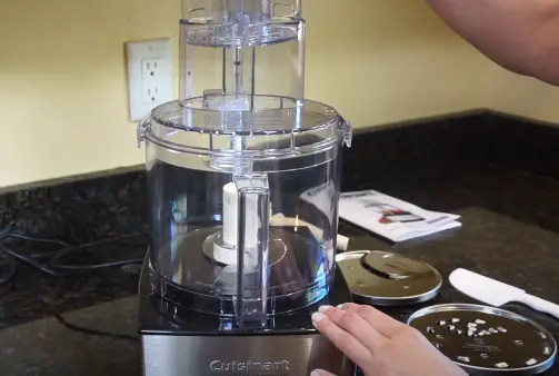 Insert Pushers into the Feed Tube Insert the Small and Large Pushers into the Feed Tube