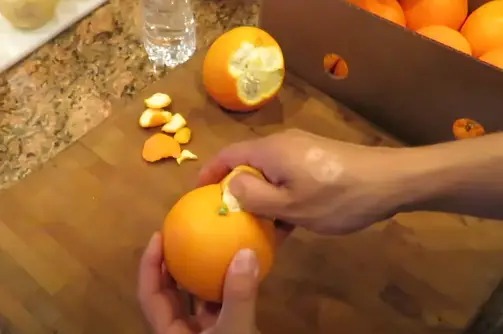 Remove the all skin off orange Once all of the skin has been removed