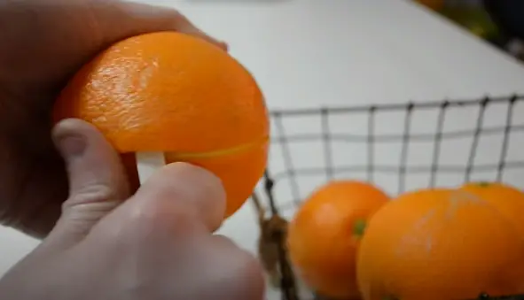 use your hands to remove any remaining pieces of pith or oils from the orange. Once you have removed all the skin