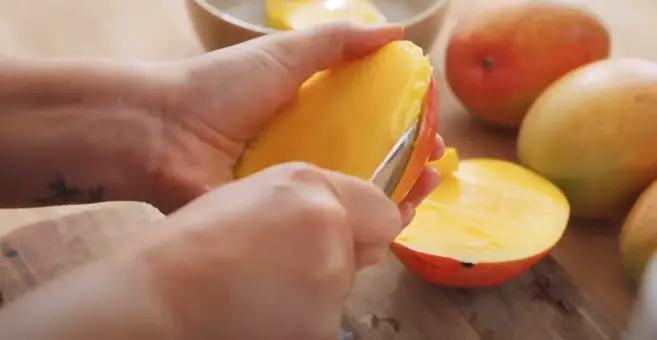 Peel the mangoes