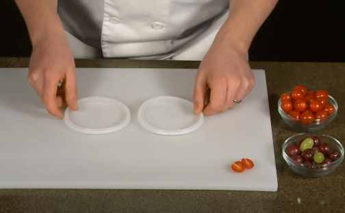 Place one lid flat-side up on your cutting board
