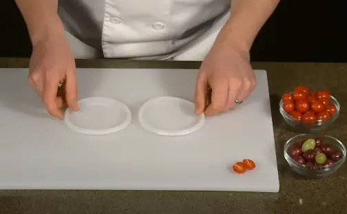 Place Lids On Cutting Board For Slicing Place one lid flat-side up on your cutting board