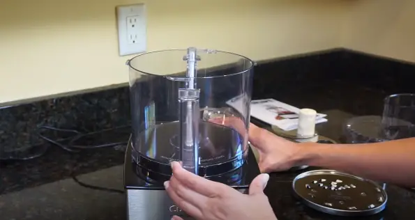 Carefully align the work bowl with the base of the food processor Place the Work Bowl on the Base