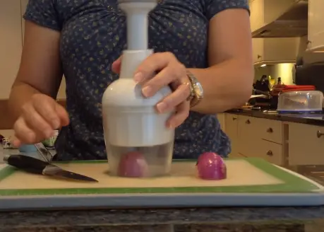 Peel the onion and cut off the root end Preparing the Onion