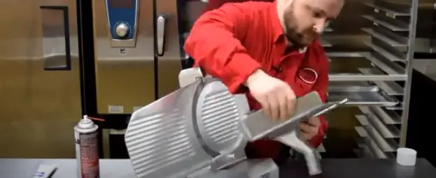 Undo the release knob and set the food chute aside Remove the food chute