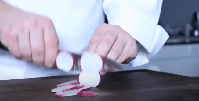 Start by slicing your radish into thin, even circles Slice into Thin Circles