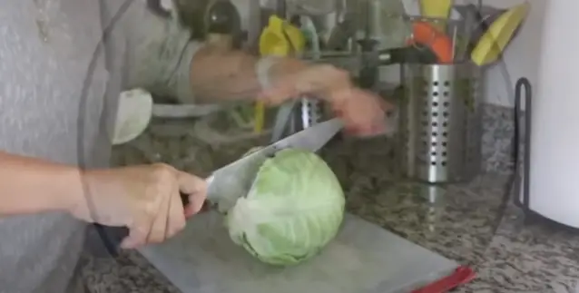 Slice the Cabbage with knife Slice the Cabbage Through the Stem