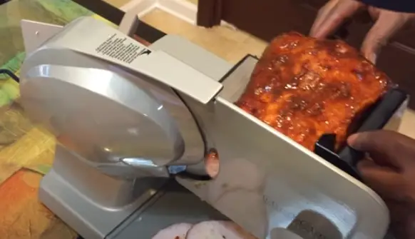 Slice The Meat Using The Slicer Slice the meat