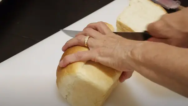 Use a gentle sawing motion with your bread knife to achieve even slices Slicing Bread Evenly