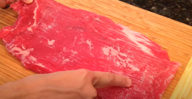 Start by identifying the grain of the meat