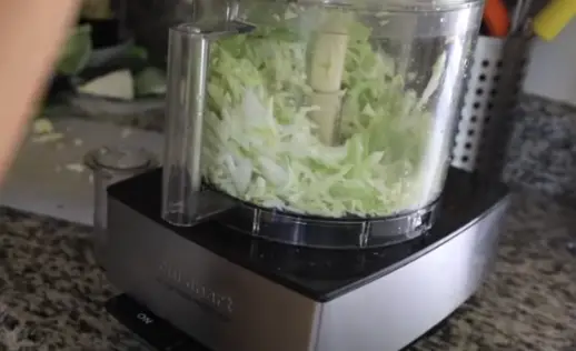 With your cabbage pieces loaded and ready, it's time to start the food processor Start the Food Processor