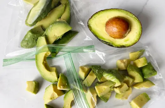 Start with fresh, ripe avocados, lemon or lime juice, Ziploc freezer bags