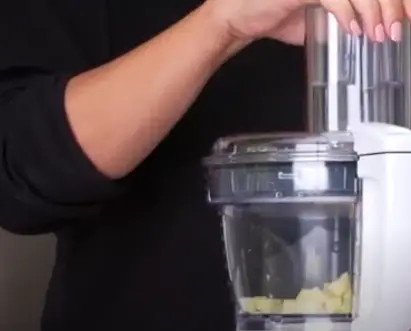 The sliced apples will collect in the bowl The sliced apples will collect in the bowl