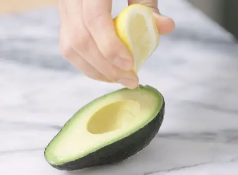 Place The Cut Avocado In A Container, Squeeze Enough Lemon Juice Over It To store an avocado using the lemon juice method