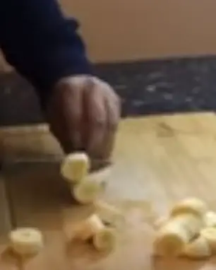Using A Sharp Knife For Slicing Banana Using a sharp knife, carefully slice down the length of the banana