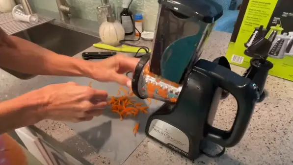 Turn on the device and it will start to shred the carrot Grate the Carrot