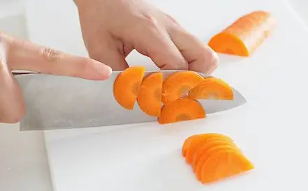 You first slice the carrot in half lengthwise to achieve this cut, then chop it into semi-circular pieces Half Moons