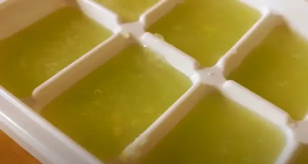 : Once the juice is ready, pour the mixture into an ice cube tray, filling each section properly Once the juice is ready, pour the mixture into an ice cube tray
